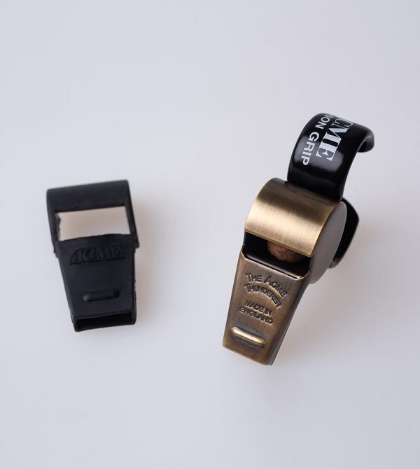 Netball umpires acme Thunderer whistle with finger grip. 477/58.5 Thunderer is the preferred whistle for Netball umpires. Netball umpires whistle in antique brass.